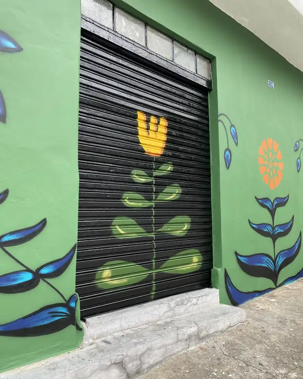 Painted flower on a black shutter