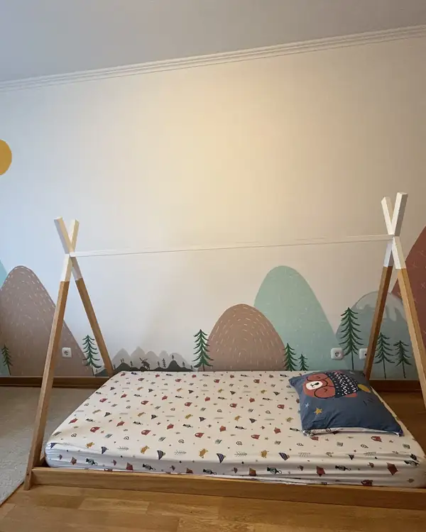 Mountain landscape mural in a children's bedroom